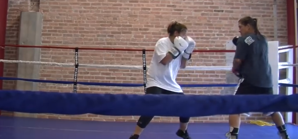 Andrea coaching a boxer